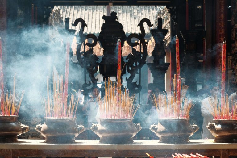 A group of incense sticks in a pot to celebrate the luna year.